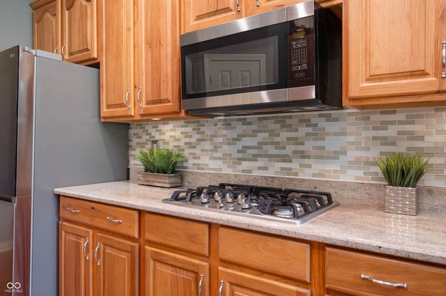 kitchen featuring a gas cooktop, microwave/microhood | Image 10