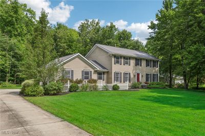 A view of this gorgeous house showing the concrete drive which leads to the attached 2-car garage | Image 2