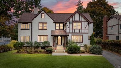 English style home featuring a yard | Image 2