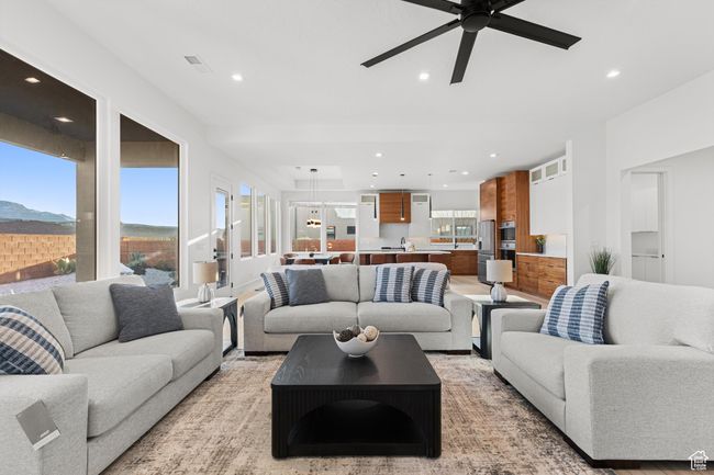 Living room featuring ceiling fan, visible vents, and recessed lighting | Image 13