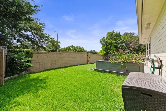 View of fenced backyard | Image 29