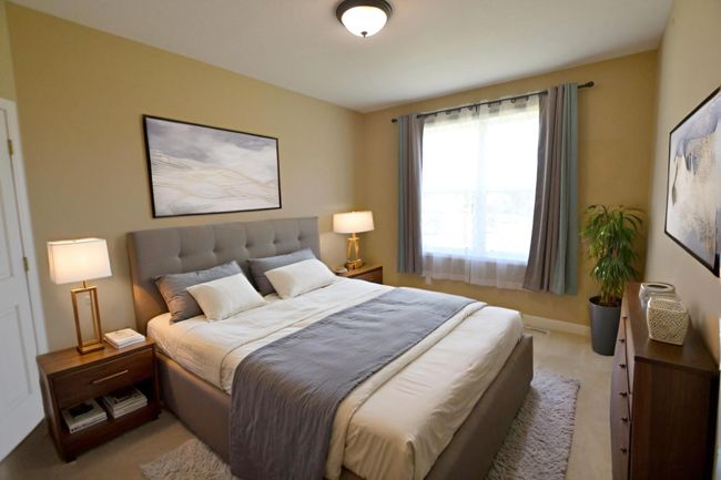 Bright owner’s retreat with vaulted ceilings, private bath, and walk-in closet. Virtually staged. | Image 4