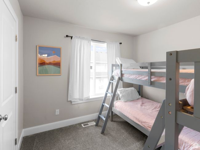 Bedroom with carpet, visible vents, baseboards, and multiple windows | Image 20