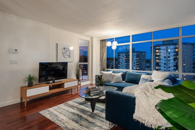 Living area featuring wood finished floors and ornamental molding | Image 11