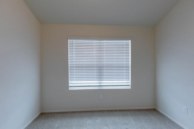 Spare room featuring carpet and baseboards | Image 16