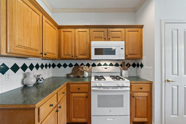 Great cabinet storage for all of your cooking and dining needs. | Image 12