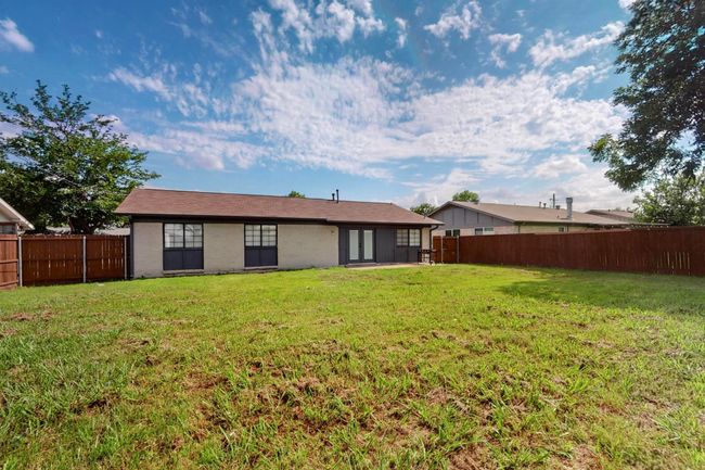 Rear view of house with a fenced backyard | Image 30