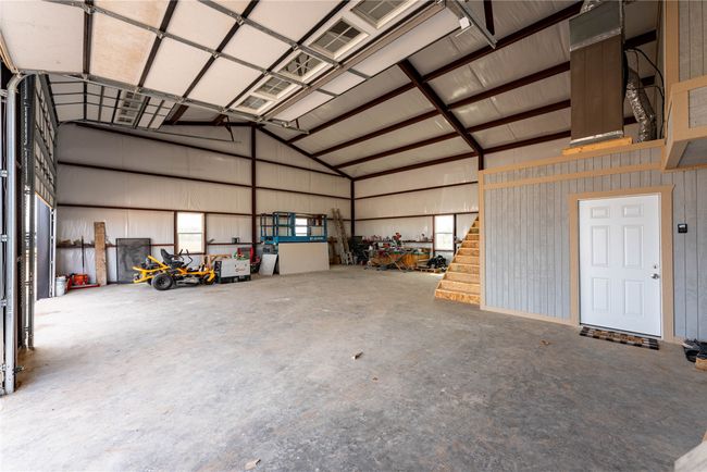 Garage featuring metal wall | Image 20