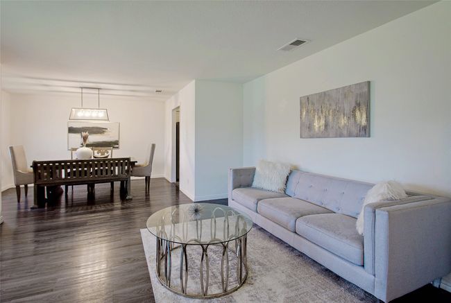 Living area featuring dark wood-style floors and baseboards | Image 5