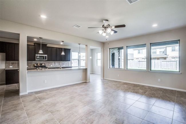 Modern Kitchen opens up to the family room | Image 9