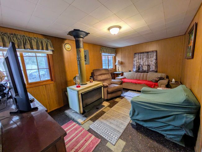Living room with newer wood burning stove | Image 6