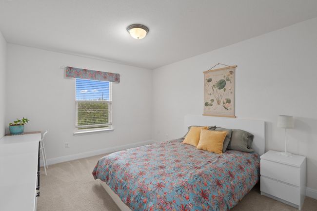 Bedroom with light carpet and baseboards | Image 24