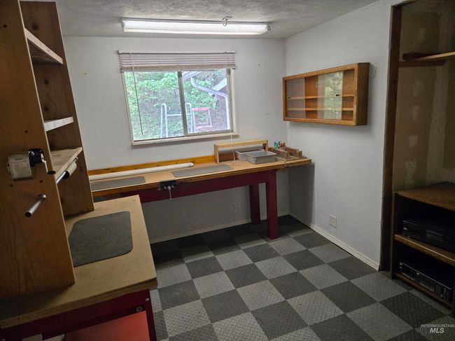 Office with dark flooring and baseboards | Image 13