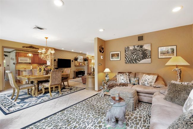 Living room featuring recessed lighting, and a brick fireplace | Image 9