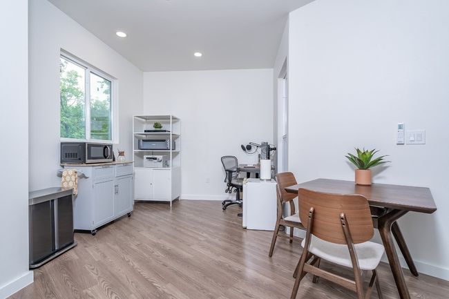 Home office featuring baseboards, light wood-style floors, and recessed lighting. We have plans for a kitchen to go here. | Image 28