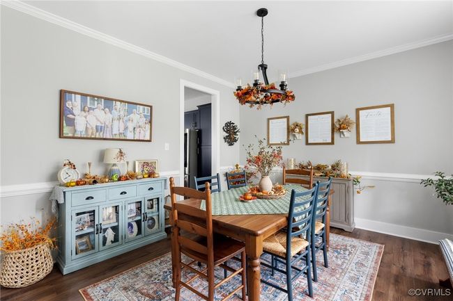 Dining area with baseboards, dark wood-style floors, and ornamental molding | Image 8
