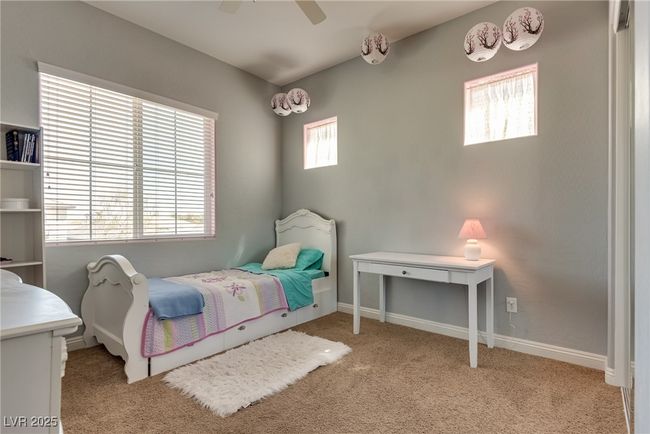Bedroom featuring baseboards, carpet floors, and a ceiling fan | Image 38