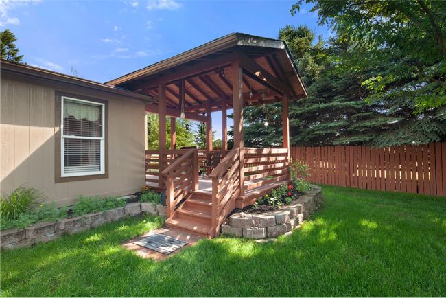 View of yard featuring a covered deck | Image 38