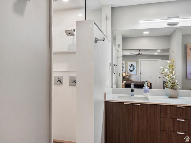 Bathroom featuring ensuite bath, vanity, and ceiling fan | Image 21