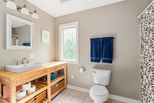 Guest bathroom with custom-built wood vanity | Image 33