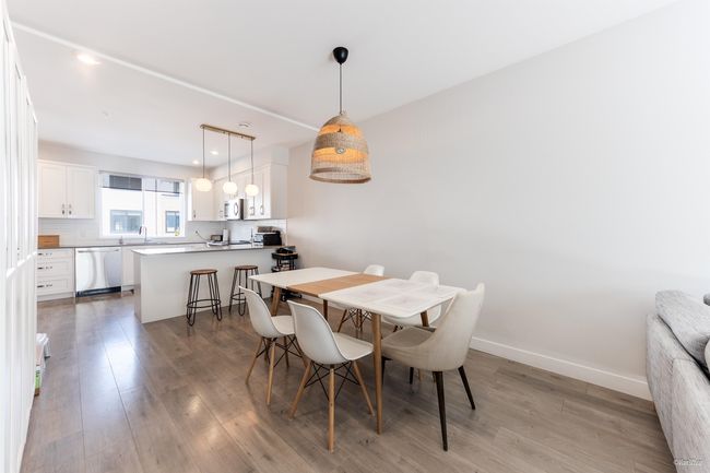 Dining space featuring light wood-style flooring and baseboards | Image 10