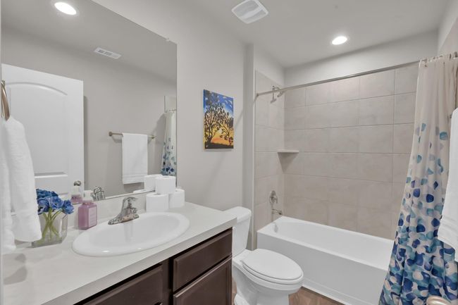 The 3rd bathroom is located upstairs off of the game room. It carries the same theme of finishes from the other bathrooms. | Image 27