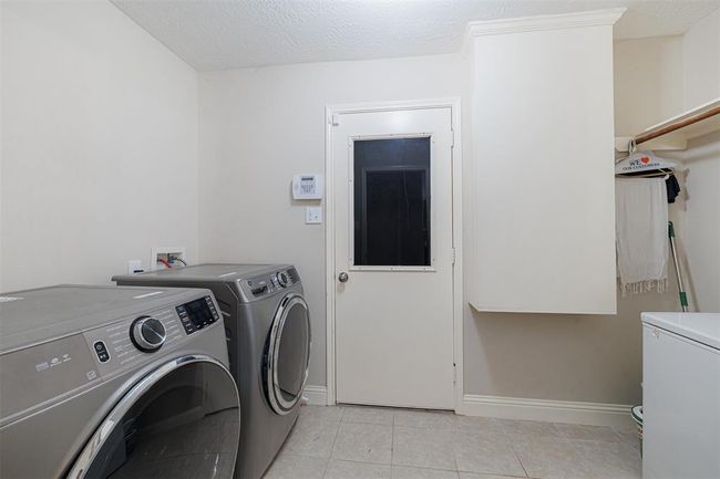 Spacious laundry room. | Image 29