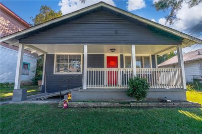 Bungalow-style house featuring a front yard | Image 1