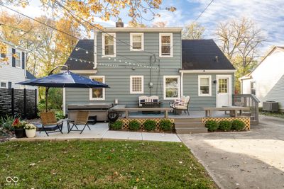 This View of the Rear of the Home shows the Beautiful Entertainment Area including a Deck, Salt Water Hot Tub, and Concrete Patio. | Image 3