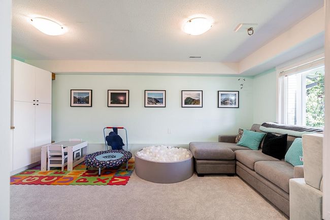 View of carpeted living room | Image 30