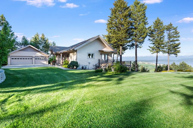 View of home and well maintained yard | Image 48