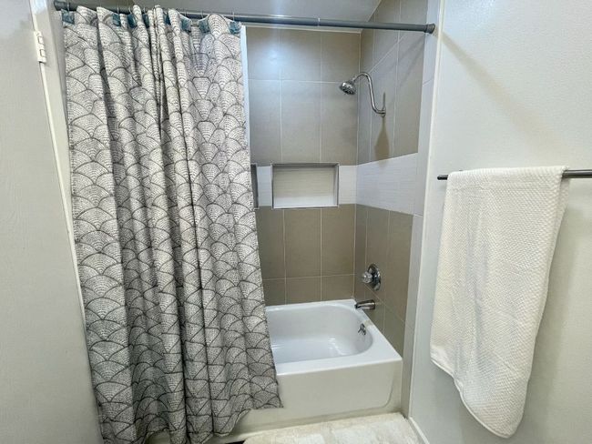 Bathroom featuring shower / bath combo with shower curtain | Image 13