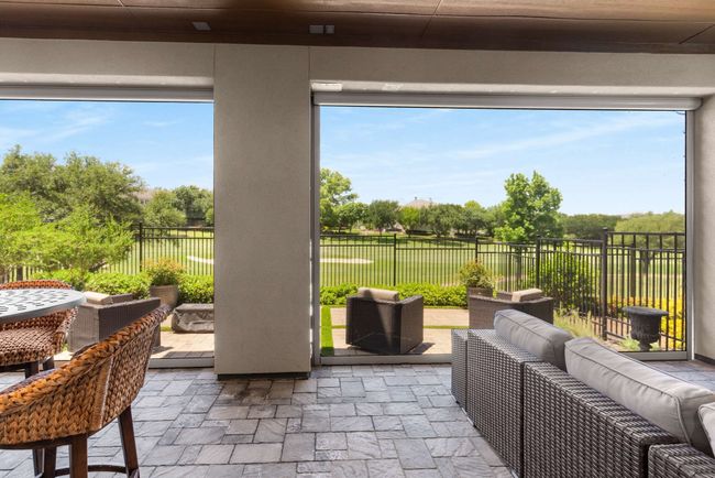 View of patio featuring an outdoor living space and a fenced backyard. | Image 33