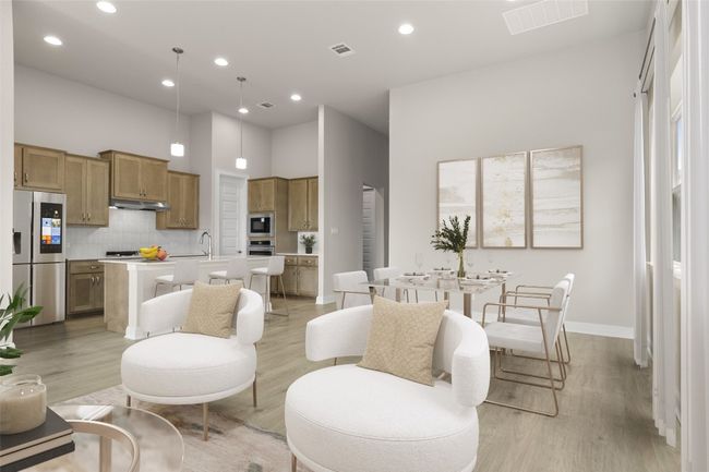 Living room featuring recessed lighting, light wood finished floors, a towering ceiling, and baseboards | Image 13
