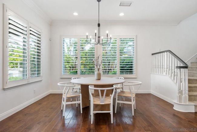 Dining area with 2nd staircase leading to the bedrooms | Image 21