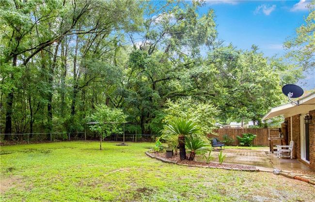 Fenced backyard featuring a patio | Image 17