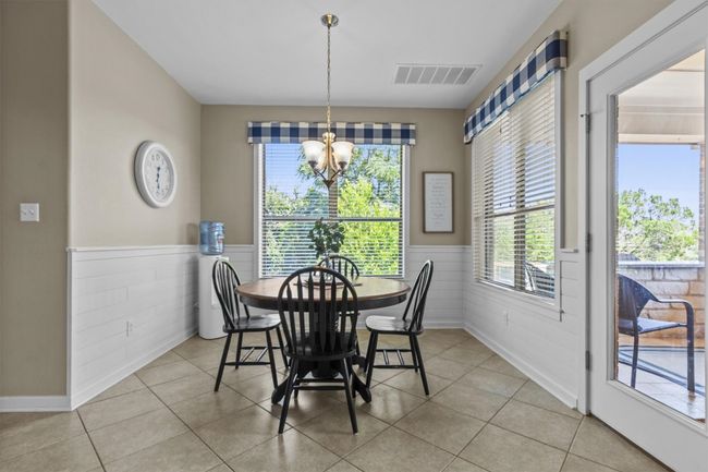 The heart of the home is ready to impress, with granite countertops, custom cabinetry, and a central island designed for both prep and conversation. | Image 10