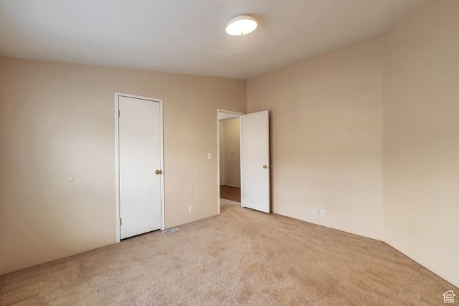 Unfurnished bedroom with carpet flooring | Image 15