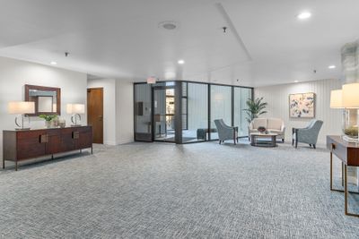 Secured entry. The common areas of the entire complex have undergone a major renovation with fresh paint, new carpet, and professional decorating. Beautifully done! | Image 3