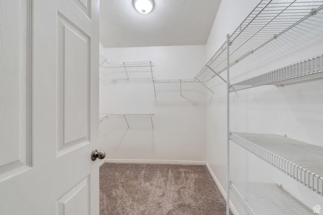 Walk in closet featuring carpet flooring | Image 13