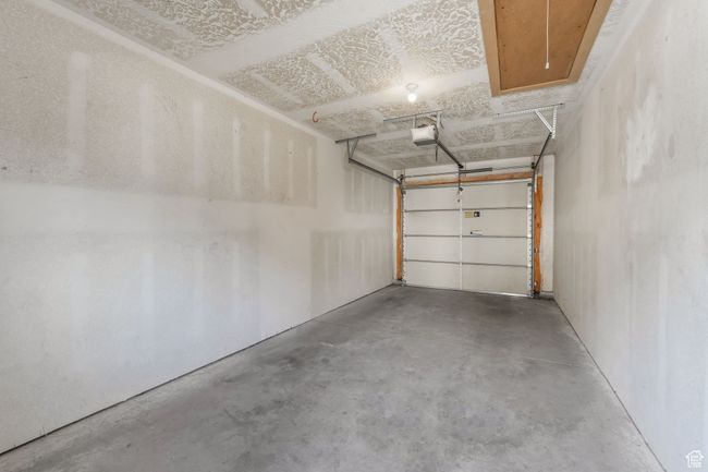 Garage with a garage door opener | Image 17