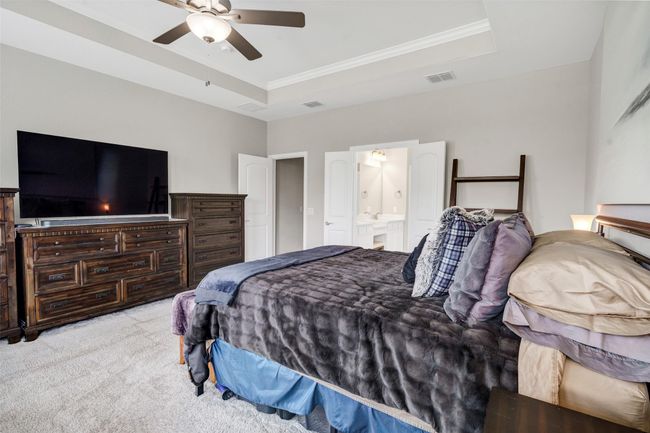 Spacious primary bedroom is accommodating for all your furniture needs. | Image 19