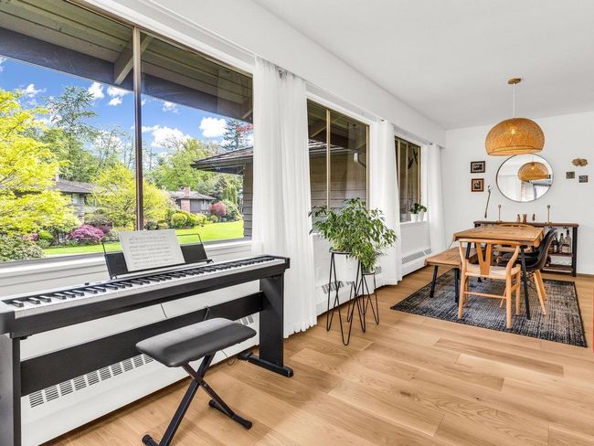 Dining area with light wood-type flooring | Image 5
