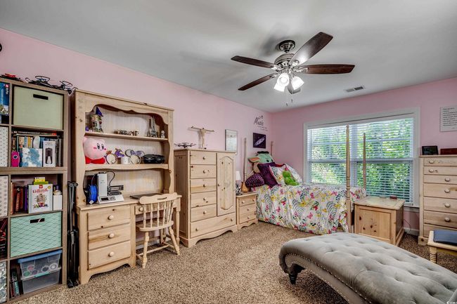 Bedroom featuring light carpet and a ceiling fan | Image 24