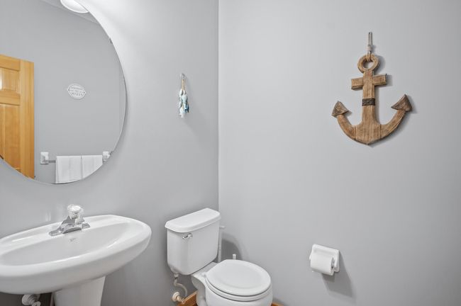 Main floor powder bath, next to the kitchen, and garage entrance. | Image 18