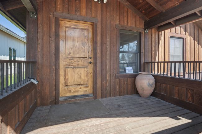 Entrance to property featuring board and batten siding | Image 5