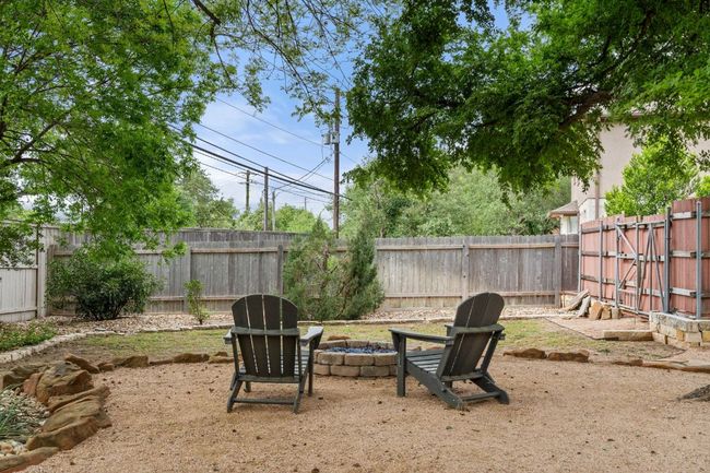 View of yard with a fire pit and a fenced backyard | Image 36