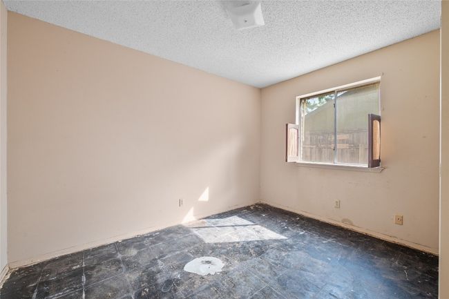 Spare room featuring a textured ceiling | Image 11