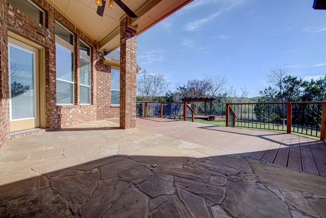 View of patio featuring a ceiling fan | Image 28