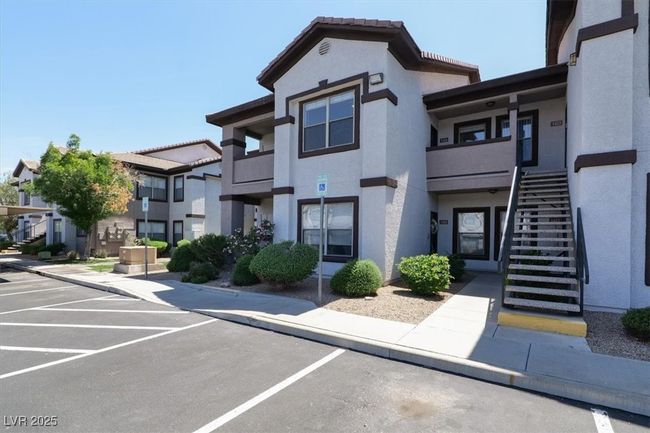 View of property with stairway and uncovered parking | Image 5